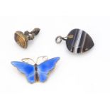A David Andersen Norwegian silver and enamel butterfly brooch, together with an agate heart shaped