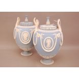 A pair of Wedgwood pottery Jasperware twin handled urns, 29cm, together with a pair of Jasperware