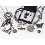 A collection silver jewels, including a floral brooch with a marcasite and simulated pearl, a