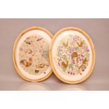 Two framed Chinese silk and embroidered oval panels, 44cm (2)