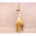 A large mid 20th century brass figure of a mule, 90cm high