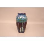 A c1920s Moorcroft Pottery Moonlit Blue pattern vase, 26cm, signed by William Moorcroft to base,