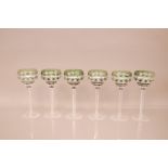 A set of six mid 20th century cut glass wine glasses, in flashed green, 20cm (6)