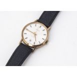 A c1980s Garrard automatic 9ct gold cased gentleman's wristwatch, 34mm, silvered dial with gilt