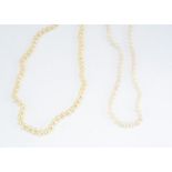 A double row of uniform cultured pearls, knotted strung with 9ct gold clasp, 6.6mm diameter, 45g, af