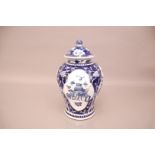 An early 20th century Chinese blue and white porcelain jar and cover, 32cm high, small chips to