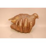 A bronze sculpture after Geraldine Knight (1933 - 2008), 38cm long, A Bird In The Hand, signed