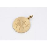 A continental 18ct circular star sign pendant, engraved with satyr and bow, Sagittarius, 2.6cm x