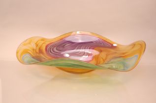 A large Studio Glass Contour Range centrepiece bowl by Bob Crooks, 69cm wide, in amber with greens
