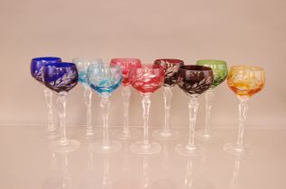 A set of twelve coloured cut glass wine glasses, 21cm (12)