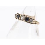 A 9ct gold cubic zirconia and sapphire five stone dress ring, ring size P, 3.2g