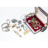 A quantity of costume jewellery and ladies watches, brooches set with paste stones and a quantity of