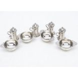 A set of four Edwardian silver miniature quaich style table salts from FR & Co Ltd, together with