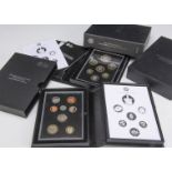 Three modern Royal Mint UK proof coin sets, including a 2013 Commemorative Edition set, and a 2013