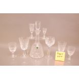 A collection of Waterford Crystal glasses and a decanter, including 8 Hock glasses, 9 red wine, 6