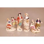 Four early 20th century porcelain groups, one couple with gardening tools, marked for Crown Derby, a