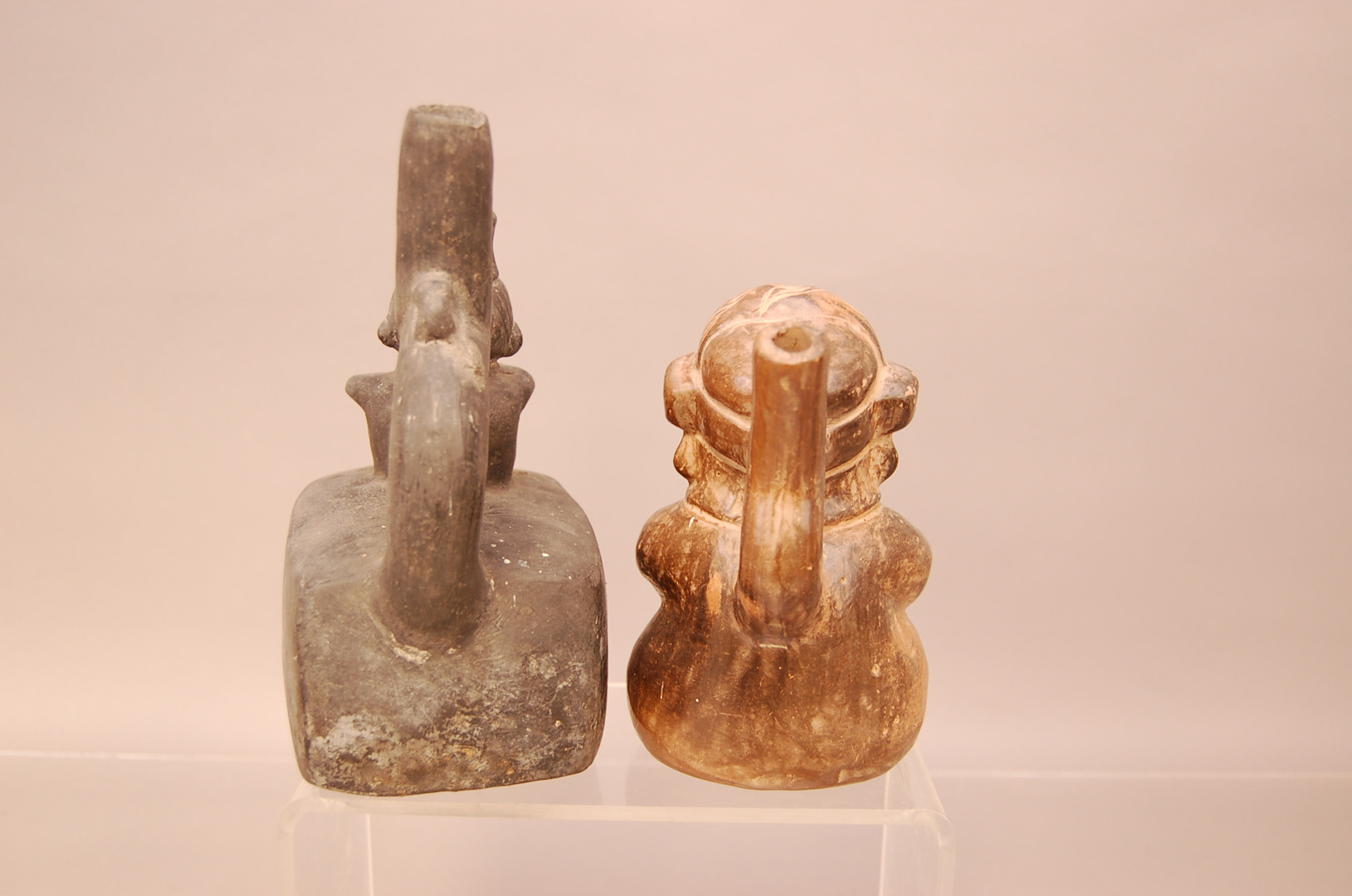 Two pre-Columbian pottery vessels, one in a material similar to basalt modelled with a man sat at - Image 2 of 3