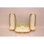 An Art Nouveau period Eichwald pottery three piece garniture, pair of vases 32cm high, with a