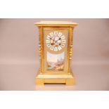 A late 19th century French gilt and porcelain mantle clock, 35.5cm high, the rectangular with four