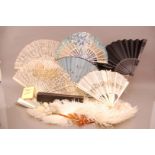 A collection of Victorian and later fans, 14 in total and a fan box, two being carved ivory, one