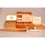 An Asprey & Co burr maple humidor and a collection of cigars, including two Romeo & Juliet in tubes,