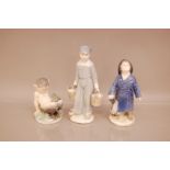 Two Royal Copenhagen figures, one of a Fawn with toad, and a young sailor boy, together with a