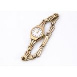 A c1960s Smiths Imperial 9ct gold lady's wristwatch, 16mm, on 9ct gold bracelet, 15.8g