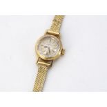 A c1960s Omega 18ct gold lady's wristwatch, 16mm, gilt dial with batons, on 18ct gold strap, AF, 18g