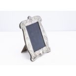 An Art Nouveau style Britannia silver mounted photograph frame by RH, 20.5cm high, with raised