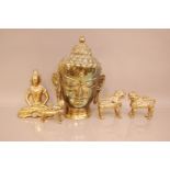 Five vintage Far Eastern brass items, including the head of a Buddha, 34cm, a pair of Fo dogs, a