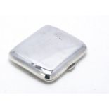 A good Edwardian silver cigarette and companion case, 9cm high, 4.6 oz., the plain curved case