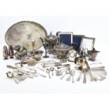 A collection of silver plate, one box, flatware, teapot and more