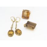 A suite of citrine and smoky quartz jewels, including a pair of yellow metal oval mixed cut