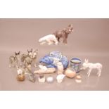 A collection of porcelain and pottery animals and other items, including a B&G elephant, several