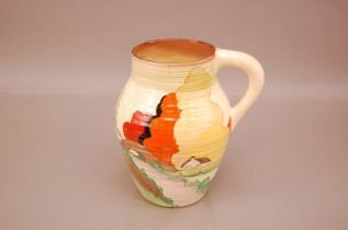 A restored Art Deco period Wilkinson & Co pottery jug by Clarice Cliff, 20cm, in the Lorna