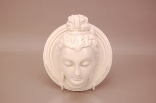 An interesting mid 20th century Indian blanc de chine bust on plaque, 20.5cm, with the head of a