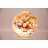 An early 20th century Royal Worcester Porcelain plate, 23.5cm, with painted pears and grapes by