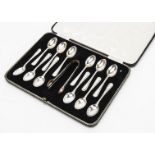 A set of George VI silver teaspoons and tongs by William Hutton & Sons, the set of twelve spoons and