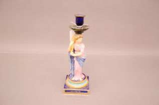 A restored 19th century Wedgwood pottery mailoica figural stick, 28cm, with repair of neck