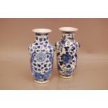 Two restored late 19th or early 20th century Chinese blue and white vases, 20.5cm, with birds and