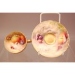 An early 20th century Royal Worcester Porcelain cabinet teacup and saucer, with painted apples,