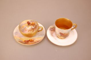 Two early 20th century Royal Worcester porcelain cabinet cups and saucers, differing shapes, both