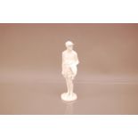 An early 20th century porcelain blanc de chine figure of a jockey, 21.5cm, marked M.R. Locke, has