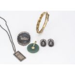 A collection of silver and Asian jewels, including a Chinese aventurine quartz pendant, a gold