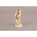 A Japanese late Meiji period carved ivory figure of Sennin Ransaika looking up at a cricket, 20cm,