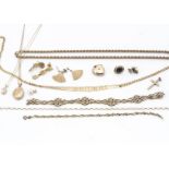 A collection of 9ct gold, including fancy bracelets, a fringe necklace, heart shaped lockets,