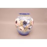 A c1920s Moorcroft Pottery Anemone pattern vase, 26cm, signed by William Moorcroft to base, some