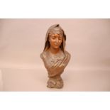 A Victorian or later bronzed spelter bust of a devotional lady after Henri Levasseur, 43cm