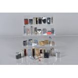 A collection of 30+ pocket lighters, comprising Ronson, Modern, Ross, Ronson Viking, IMCO, BIC and