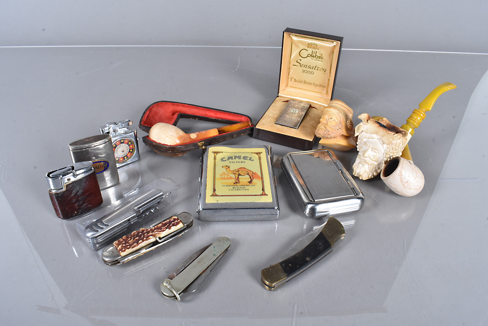 A collection of smoking related items, to include a collection of lighters, comprising a boxed